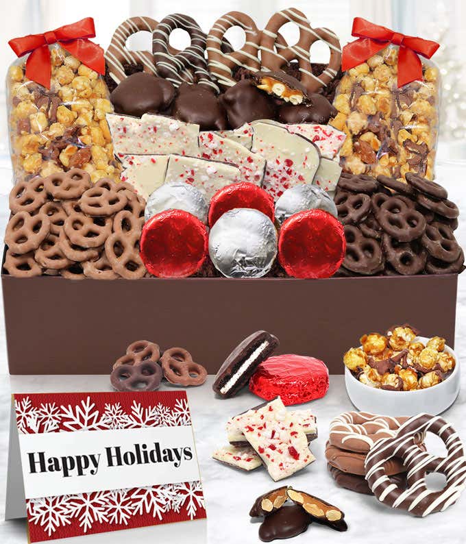 A delicious assortment: 6 milk Belgian chocolate covered OREO® cookies, caramel popcorn (milk & dark), almond caramel clusters, peppermint bark, pretzel twists (dark & milk), and mini-pretzel twists (dark & milk), elegantly presented in a gift box.
