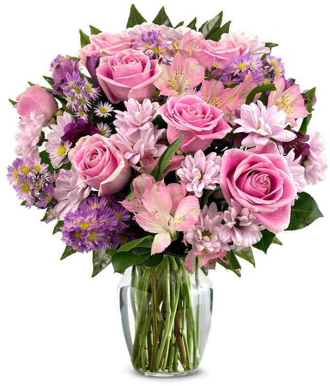 A bouquet featuring pink roses, purple daisies, pink alstroemeria, purple alstroemeria, and purple Monte Casino, with an optional vase.