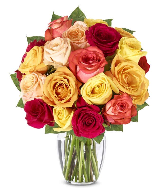 A stunning arrangement featuring one and a half dozen fall roses in vibrant autumn colors.