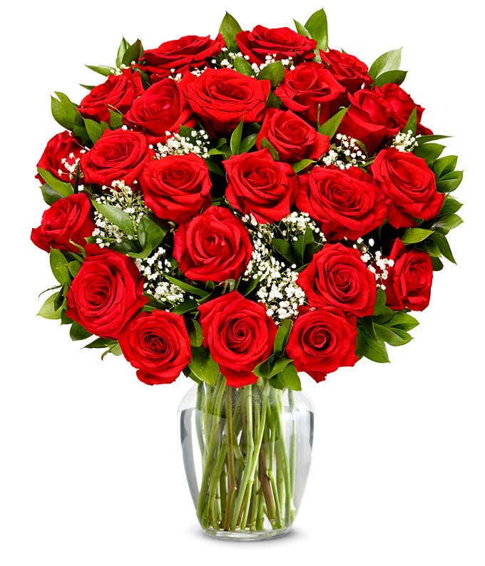  A stunning arrangement featuring 24 long stem red roses, optionally presented in a vase. This classic and romantic display is perfect for making any occasion truly special and memorable.