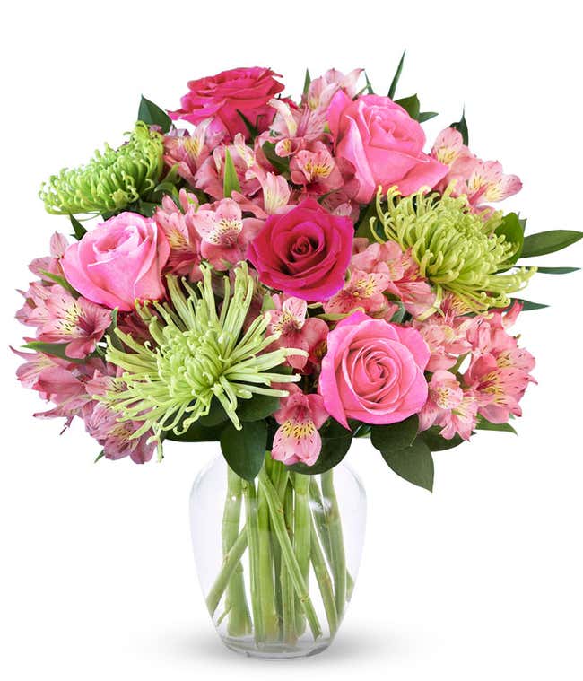 A bouquet featuring pink roses, hot pink roses, green Fuji mums, and pink alstroemeria, with an optional glass vase.