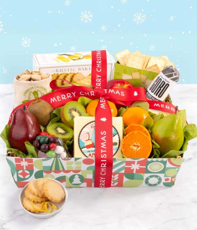 A gourmet holiday basket featuring fresh apples, pears, and oranges alongside artisan cheese, crackers, salami, pistachios, and festive candies.