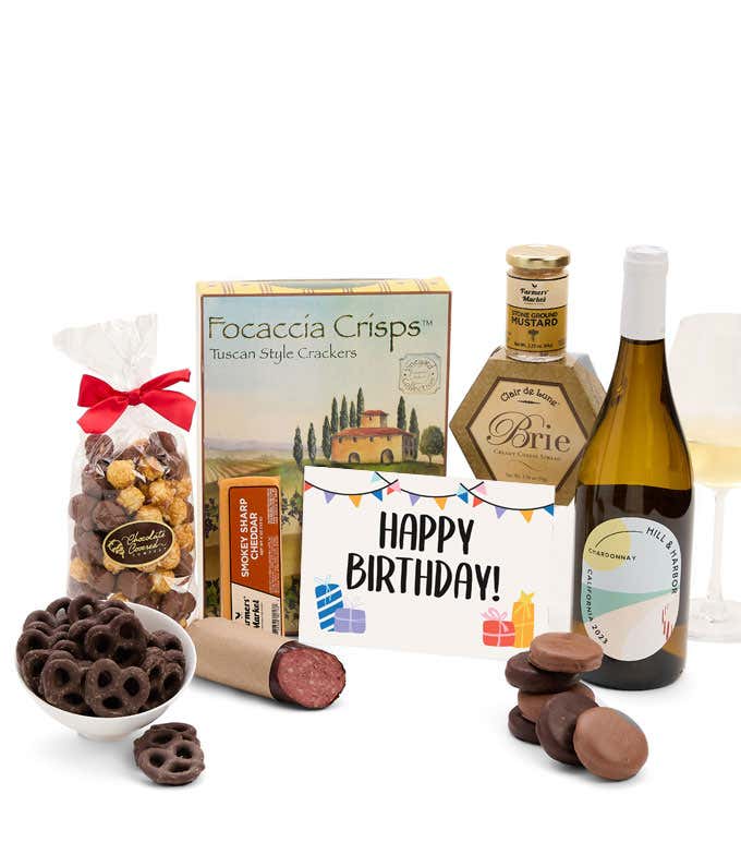A gift set featuring a bottle of California Chardonnay, focaccia crisps, two cheeses, mustard, summer sausage, caramel popcorn, chocolate pretzels, six chocolate-covered Oreos and a Birthday card to complete the gourmet experience.
