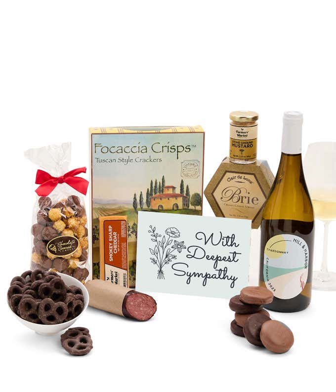 A gift set with a bottle of California Chardonnay, focaccia crisps, two cheeses, mustard, summer sausage, caramel popcorn, chocolate pretzels, six chocolate-covered Oreos and a Sympathy card to show your support.
