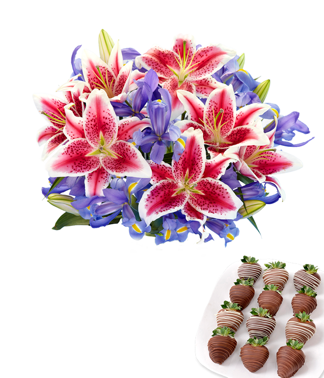 Partial image of Clear glass vase filled with a vibrant bouquet of hot pink stargazer lilies and deep violet-blue irises, paired with a plate of swizzled chocolate-covered strawberries drizzled in dark and white chocolate. without vase.